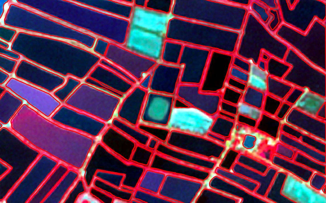 Segmented pond boundaries outlined over a false colour satellite composite